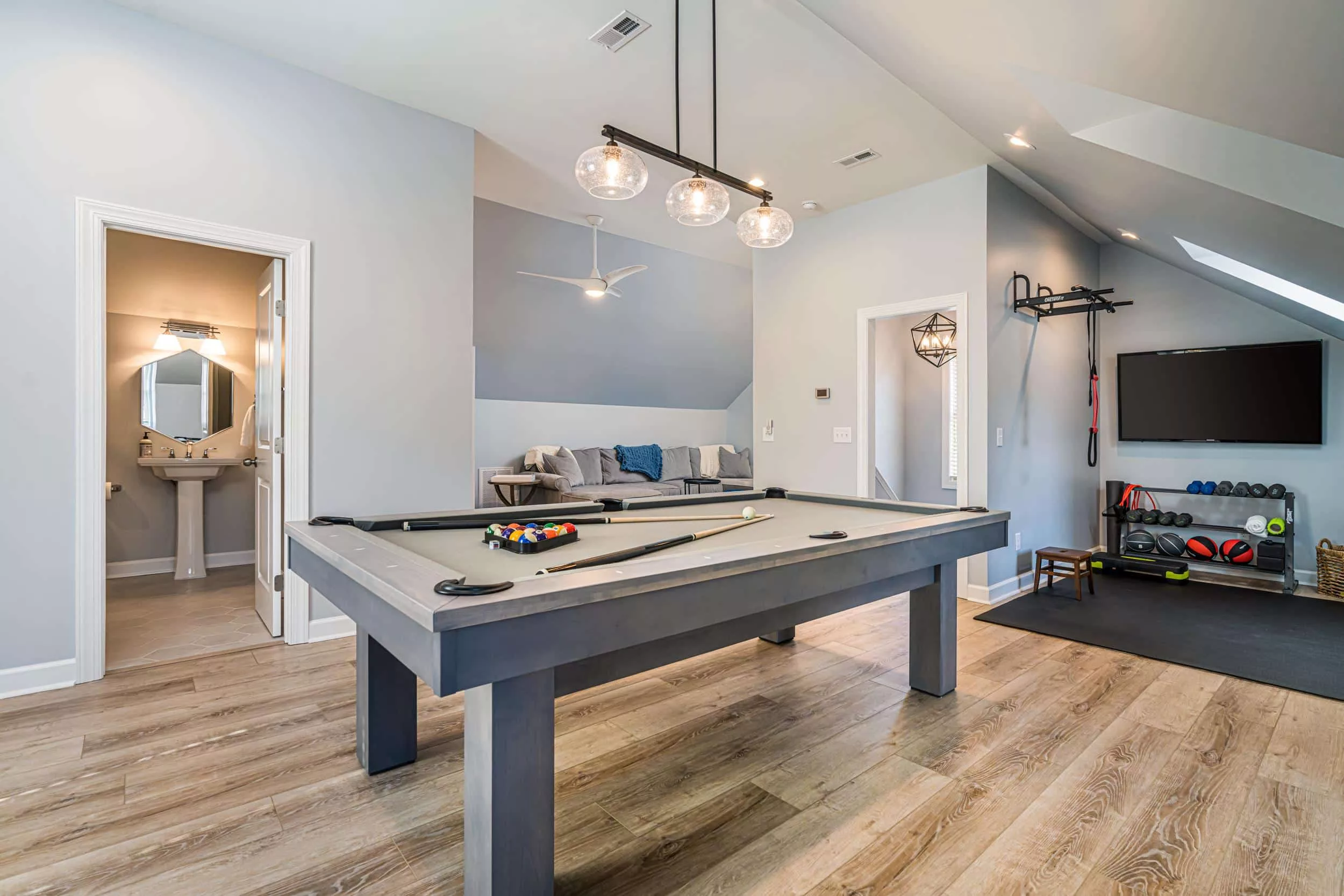 Media room, game room, and workout space: all in one.