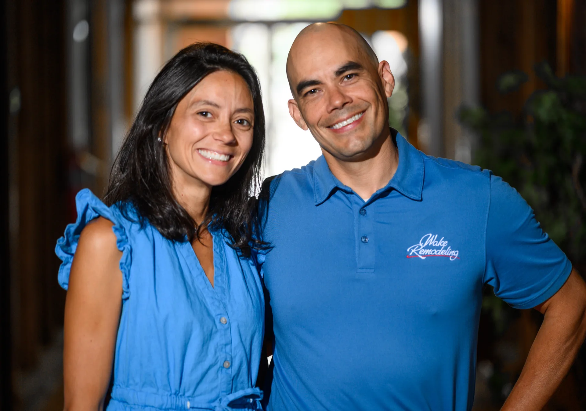 Two members of the Wake Remodeling team smiling together