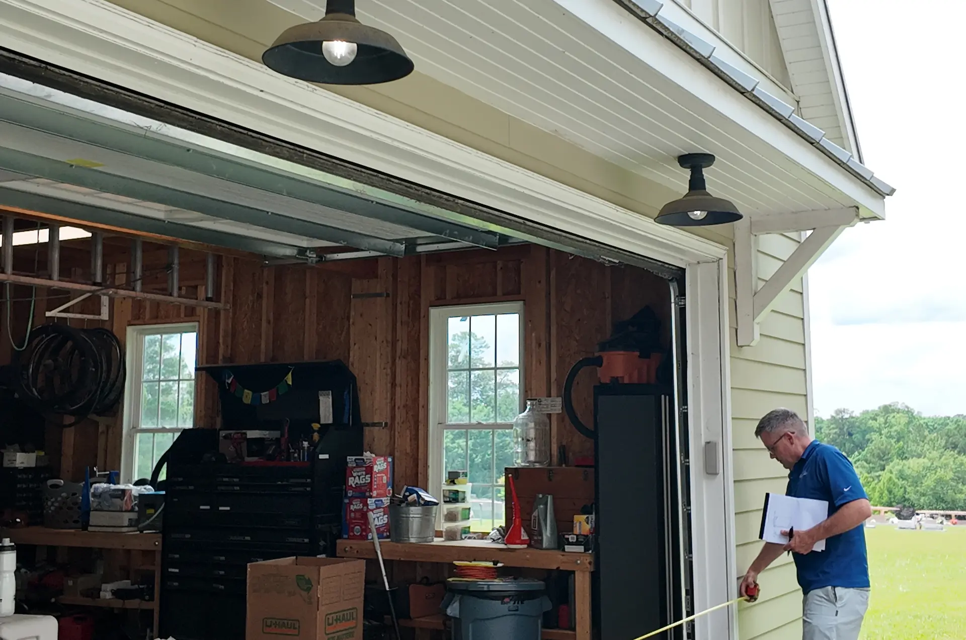 Wake Remodeling designer taking formal site measurements during concept design phase