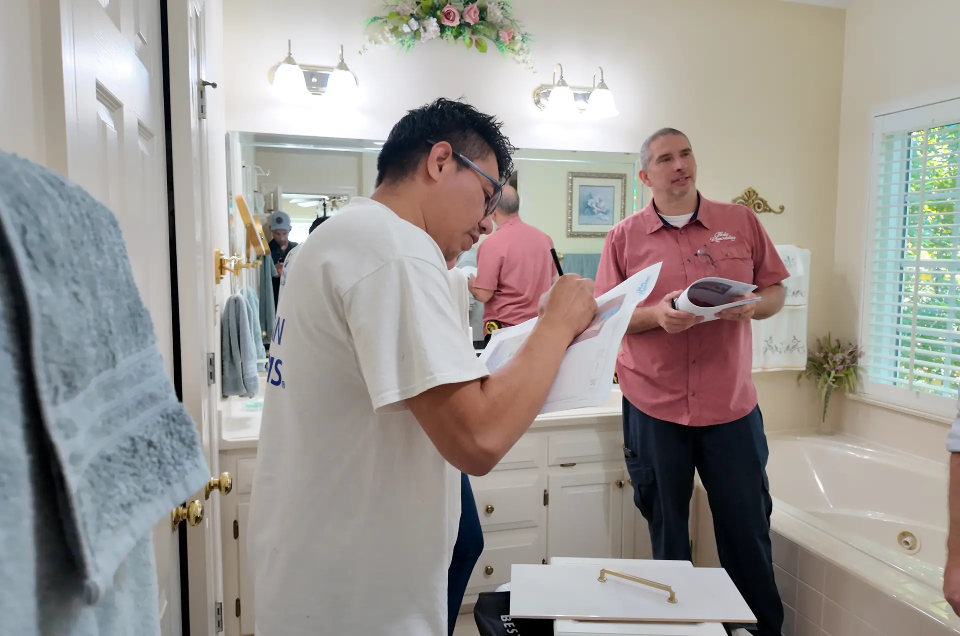 Wake Remodeling team reviewing finalized plans and material selections with homeowner